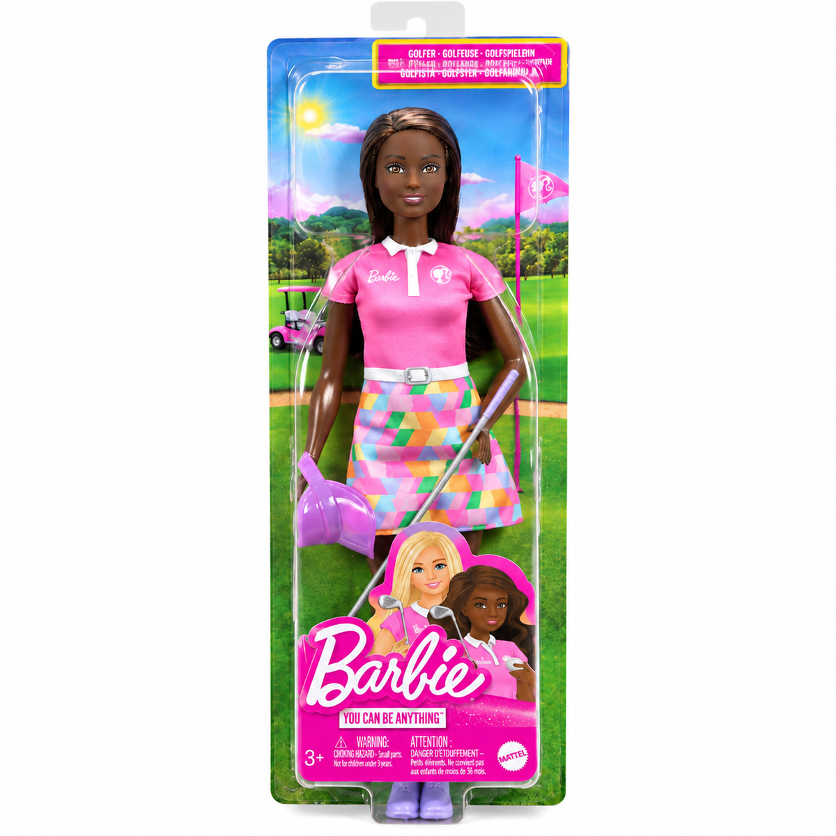 Barbie golf doll in retail packaging, featuring a dark-skinned female doll wearing a pink polo shirt and a colorful geometric skirt, holding a golf club and watering can on a golf course backdrop.