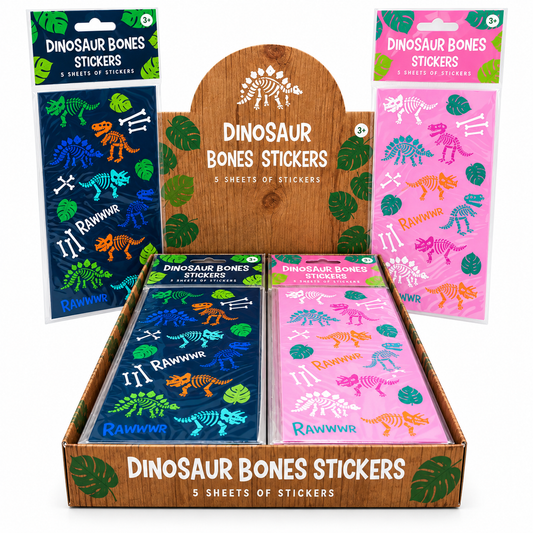A retail display box filled with dinosaur bones stickers in two colorways: a dark blue pack with green and orange bones, and a pink pack with purple, blue, and orange bones. Two additional sealed packs stand behind the display, one dark blue and one pink.