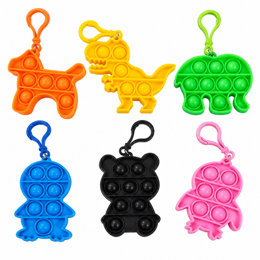 Six colorful pop-it fidget keychains shaped like a dog, dinosaur, turtle, penguin, bear, and bird, arranged in two rows on a plain white background.