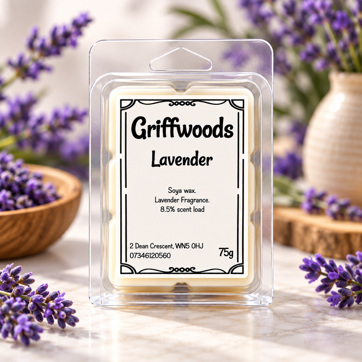 A packaged Griffwoods Lavender soya wax melt in a clear plastic clamshell package, set on a marble surface with lavender sprigs and a ceramic vase in the background.