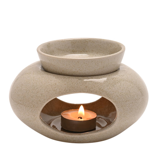 Hestia, Beige and speckled pebble shaped ceramic wax/oil burner with a removable bowl and ampul room for a lit candle inside