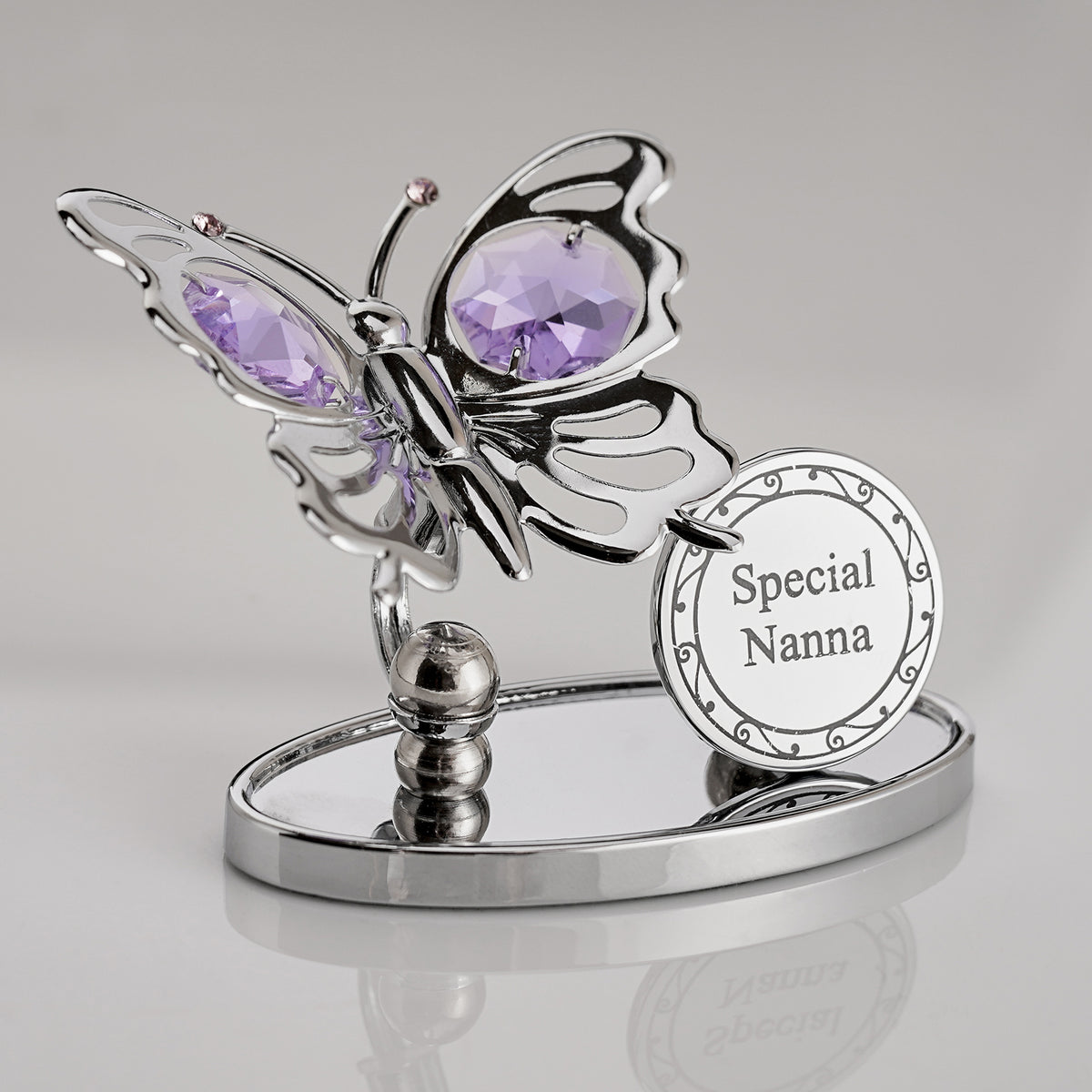 Bohemia Butterfly-shaped die cast decorative item with purple gemstones and 'Special Nanna' plaque on a gray background