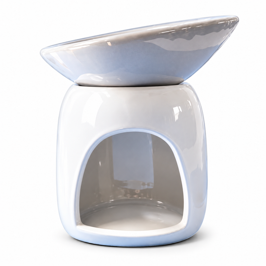 A glossy ceramic oil lamp with a rounded white body, an arched opening at the bottom, and a matching shallow bowl on top, finished in a pale icy blue and white glaze.