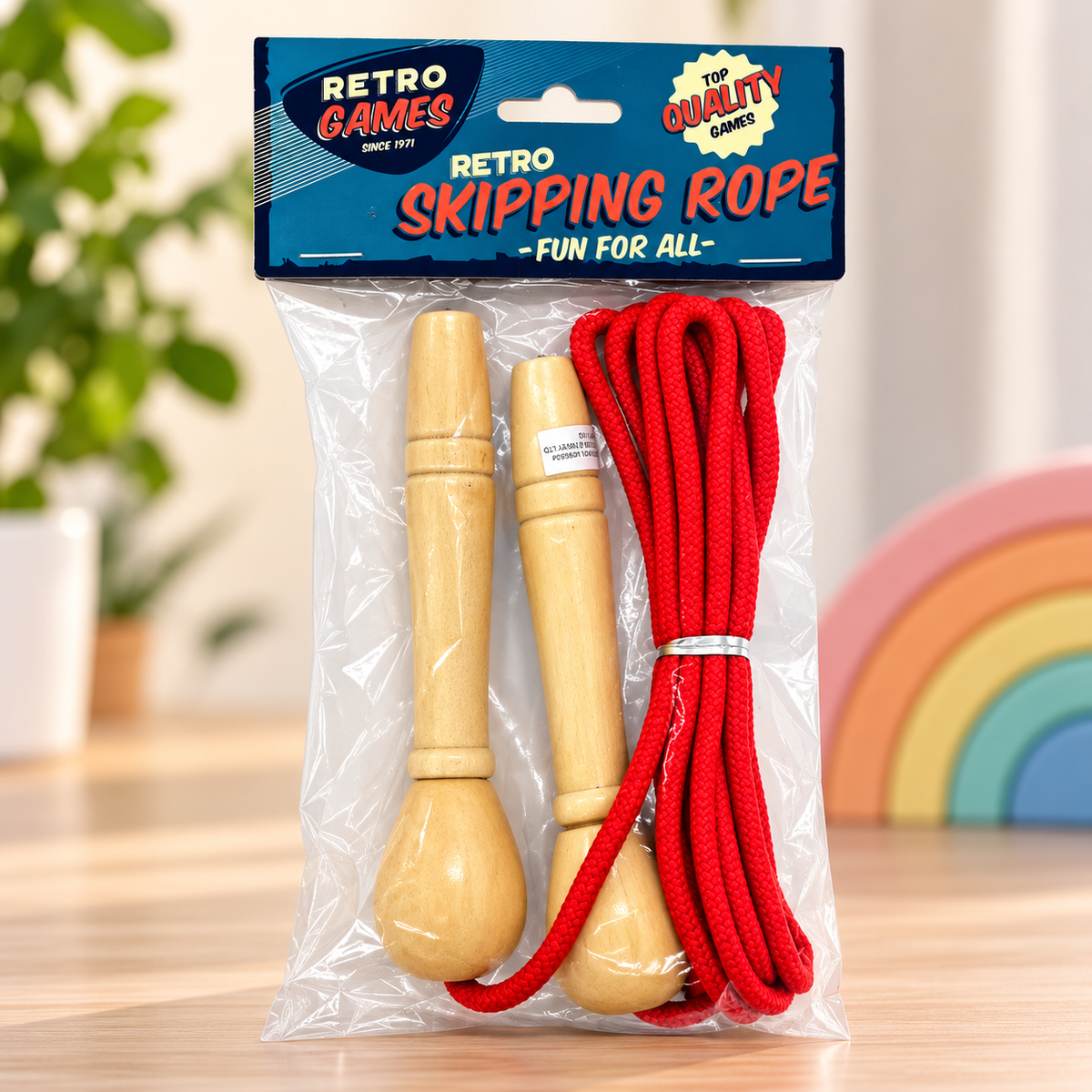 A packaged children's skipping rope set with bright red rope and light natural wood handles, sealed in a clear plastic bag with a blue header card reading 'RETRO SKIPPING ROPE' and 'Retro Games'.