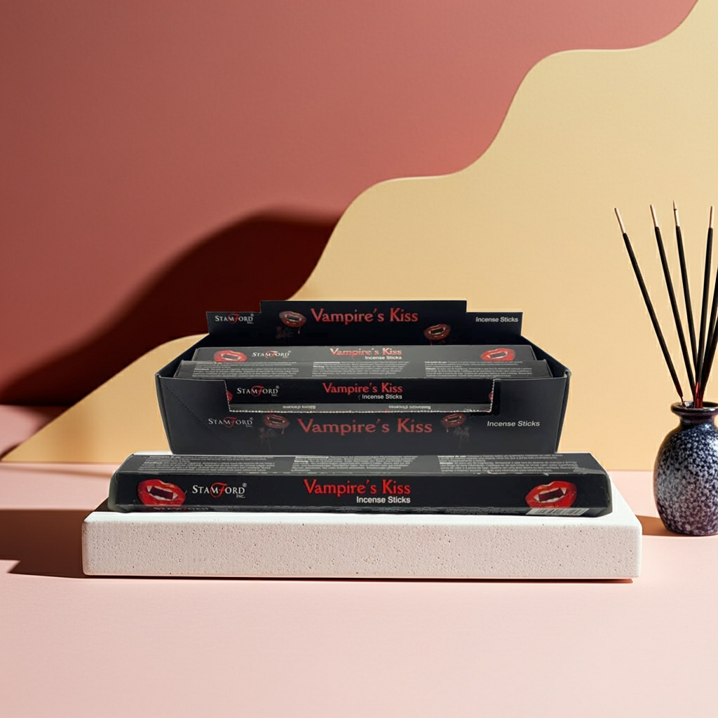 Stamford Vampire's Kiss incense sticks packaging on a pink surface with a decorative vase.