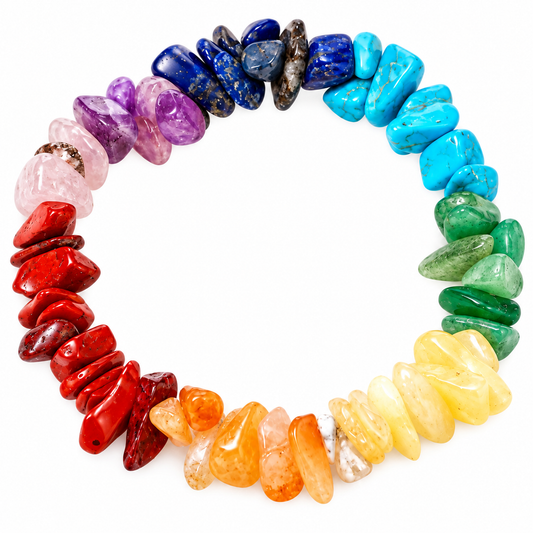 A circular crystal bead bracelet made of polished, irregular gemstone chips arranged in a rainbow sequence on a plain white background.