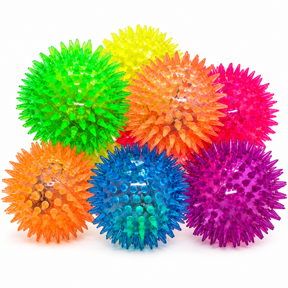 Colourful spiky balls that bounce and light up on a multicoloured background