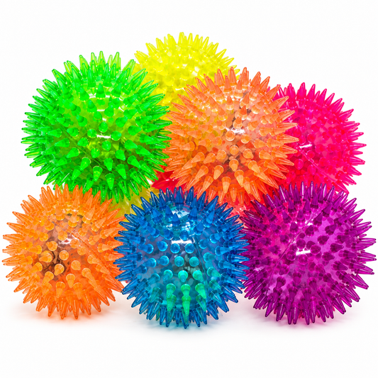 Colourful spiky balls that bounce and light up on a multicoloured background