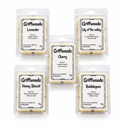 Five Griffwoods wax melts in clear plastic hangers arranged in a 2x2 grid with one centered in front. The labels show different scents: Lavender, Lily of the valley, Cherry, Honey Biscuit, and Bubblegum.