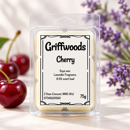 Griffwoods Cherry soya wax melts in a clear plastic clamshell package, styled on a light marble surface with red cherries and purple lavender flowers in the background.