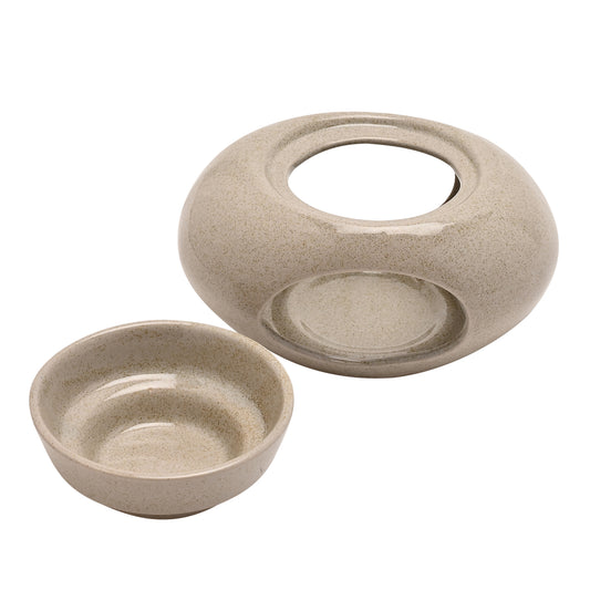 Hestia, Beige and speckled pebble shaped ceramic wax/oil burner with a removable bowl and ampul room for a lit candle inside showing the bowl removed from the base.
