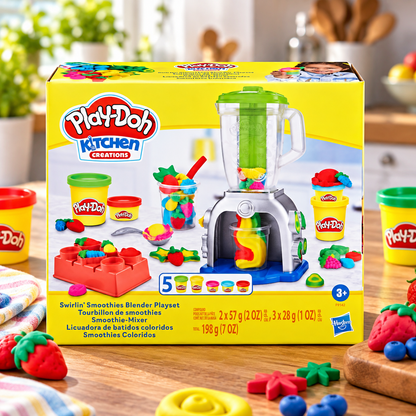 Play-Doh Kitchen Creations Swirls Smoothies Blender Playset in its original yellow box, displayed on a wooden table with colorful play-doh accessories and strawberries.