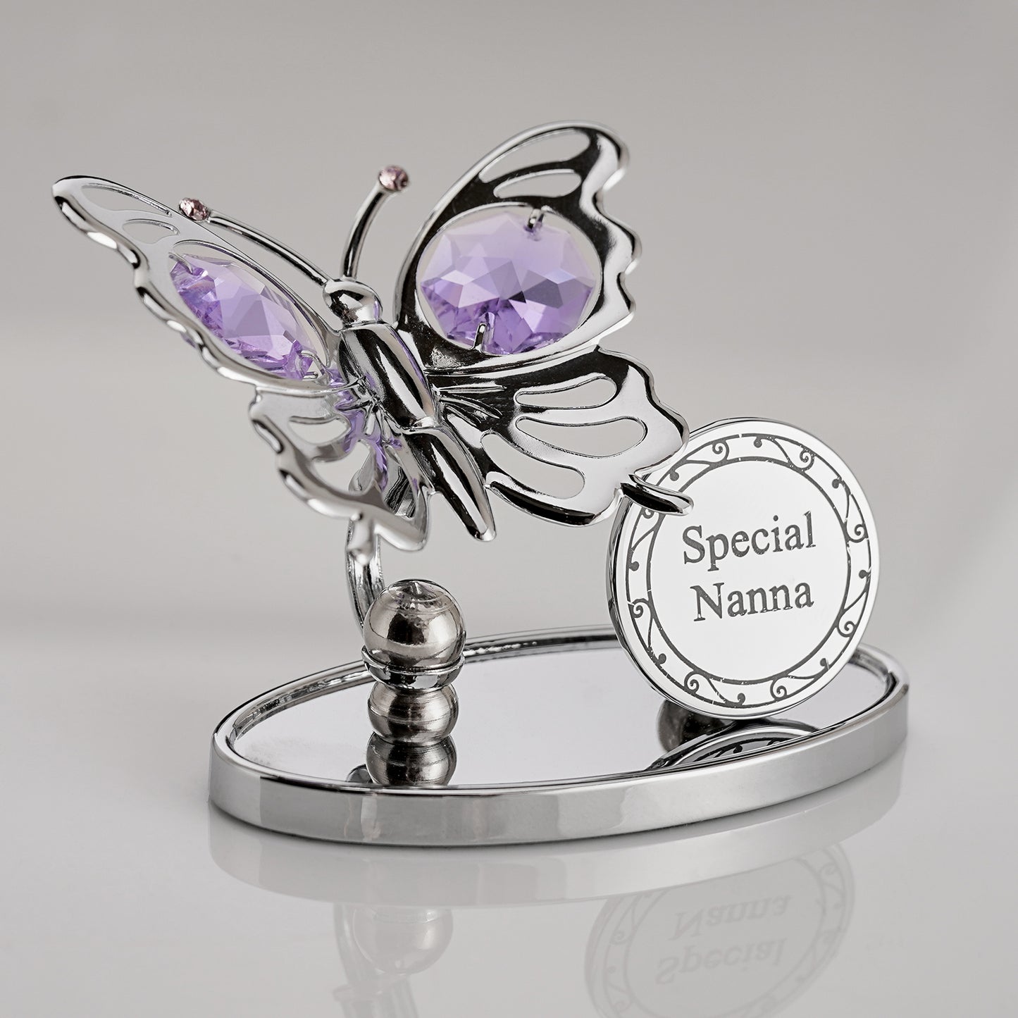 Bohemia Butterfly-shaped die cast decorative item with purple gemstones and 'Special Nanna' plaque on a gray background