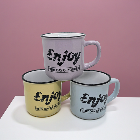 Three mugs, Blue, Pink and Yellow with 'Enjoy every day of your life' text on a pink background