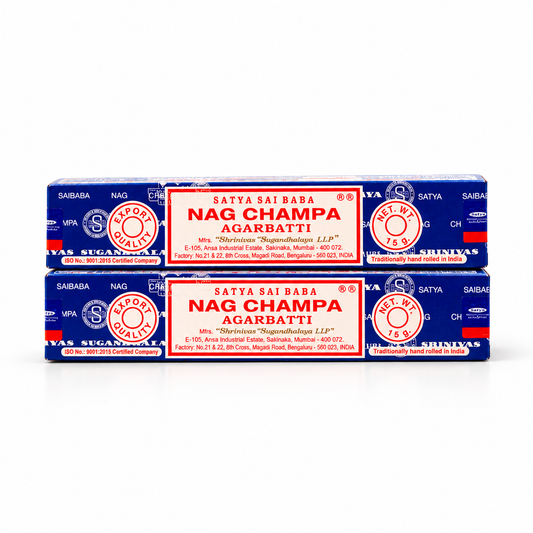 Two blue and red boxes of Satya Sai Baba Nag Champa Agarbatti (candle wicks) stacked horizontally on a white background.