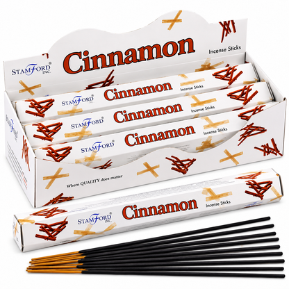 A display box of Stamford Inc. Cinnamon incense sticks, with several individual boxes, a single long box, and a fan of black incense sticks with tan tips arranged in front on a white background.