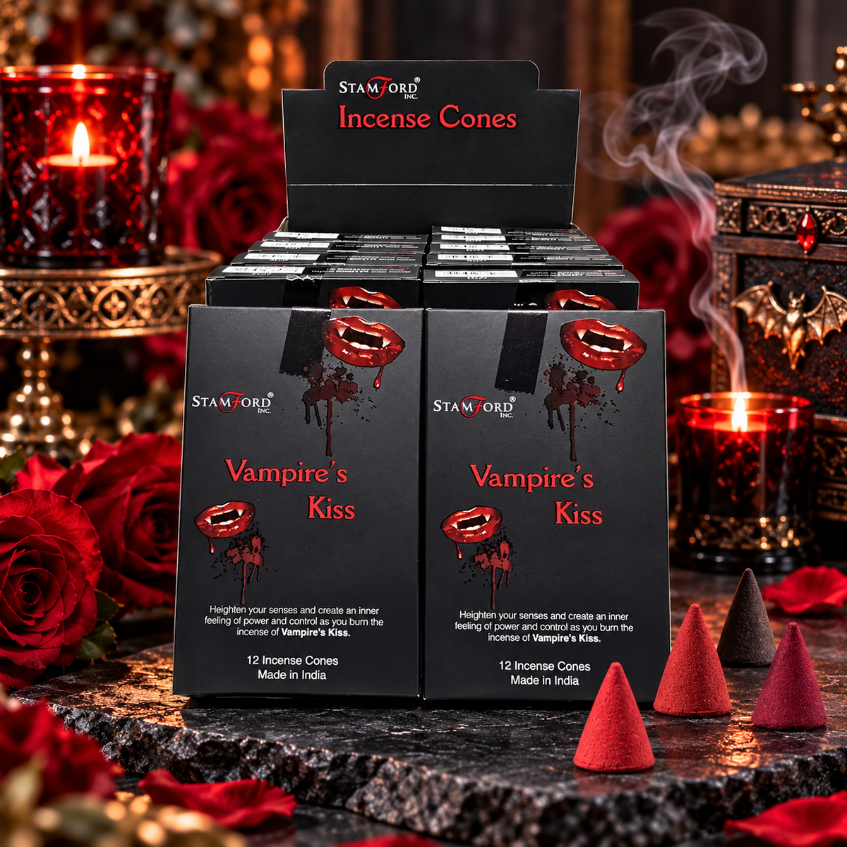 A retail display of STAMFORD Vampire's Kiss Incense Cones, showing multiple black boxes with red and white graphics, surrounded by red roses, lit candles, and smoking incense cones on a dark stone surface.