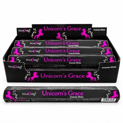 A display box of Stanford Unicorn's Grace incense sticks, showing multiple black boxes stacked inside and one box in front, featuring a bright pink unicorn graphic and white text on a white background.
