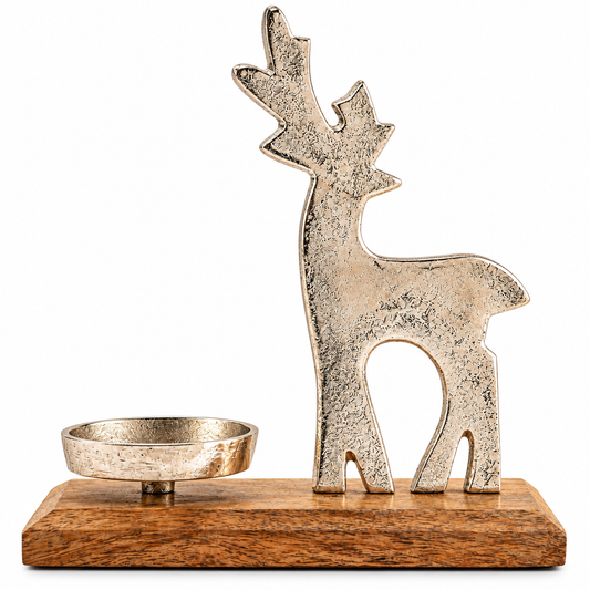 A decorative holiday centerpiece featuring a distressed silver reindeer silhouette standing on a rectangular wooden base, with a small matching silver bowl to the left, photographed against a solid white background.