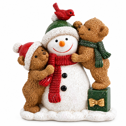 A festive resin figurine of a snowman with three teddy bears. The snowman wears a green and white Santa hat, a red knit scarf, and has black buttons.