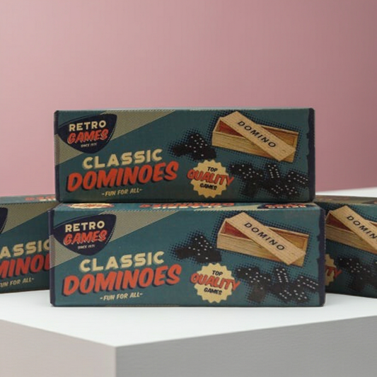 Three boxes of 'Retro Games Classic Dominoes' on a light pink background