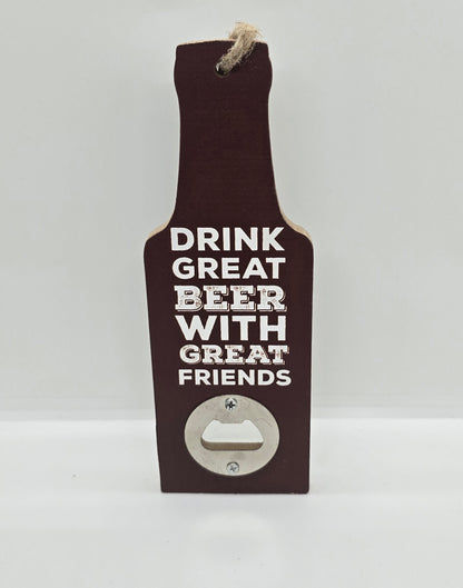 Two wooden hanging beer bottle-shaped bottle openers in a brown colour  with text "Drink great beer with great friends" on a white background