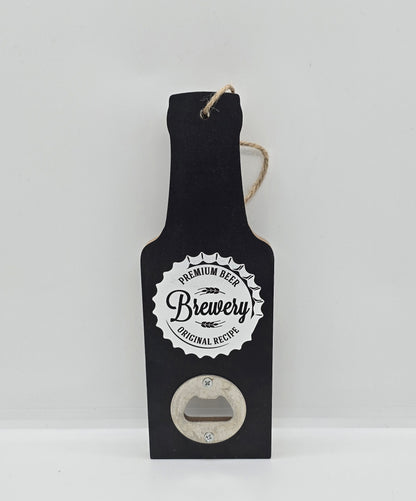 Two wooden hanging beer bottle-shaped bottle openers in black with a bottle cap design with words "Premium beer, Brewery, Original recipe" on a white background