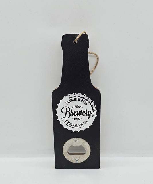 Two wooden hanging beer bottle-shaped bottle openers in black with a bottle cap design with words "Premium beer, Brewery, Original recipe" on a white background