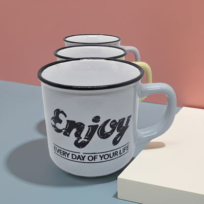Blue mug with black text 'Enjoy Every Day of Your Life' on a gradient background